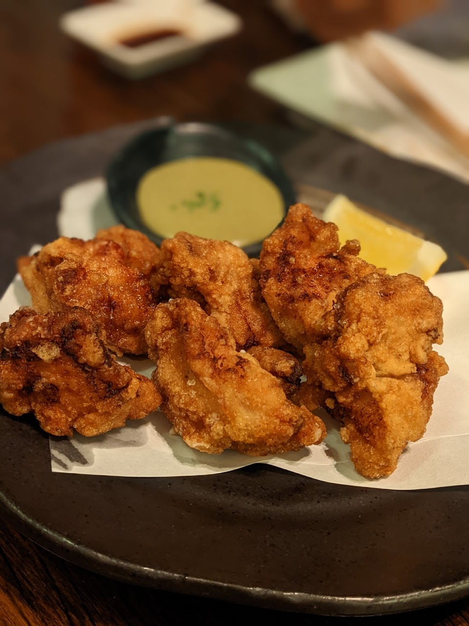 Crispy hot starter with dipping sauce at Saké Restaurant & Bar